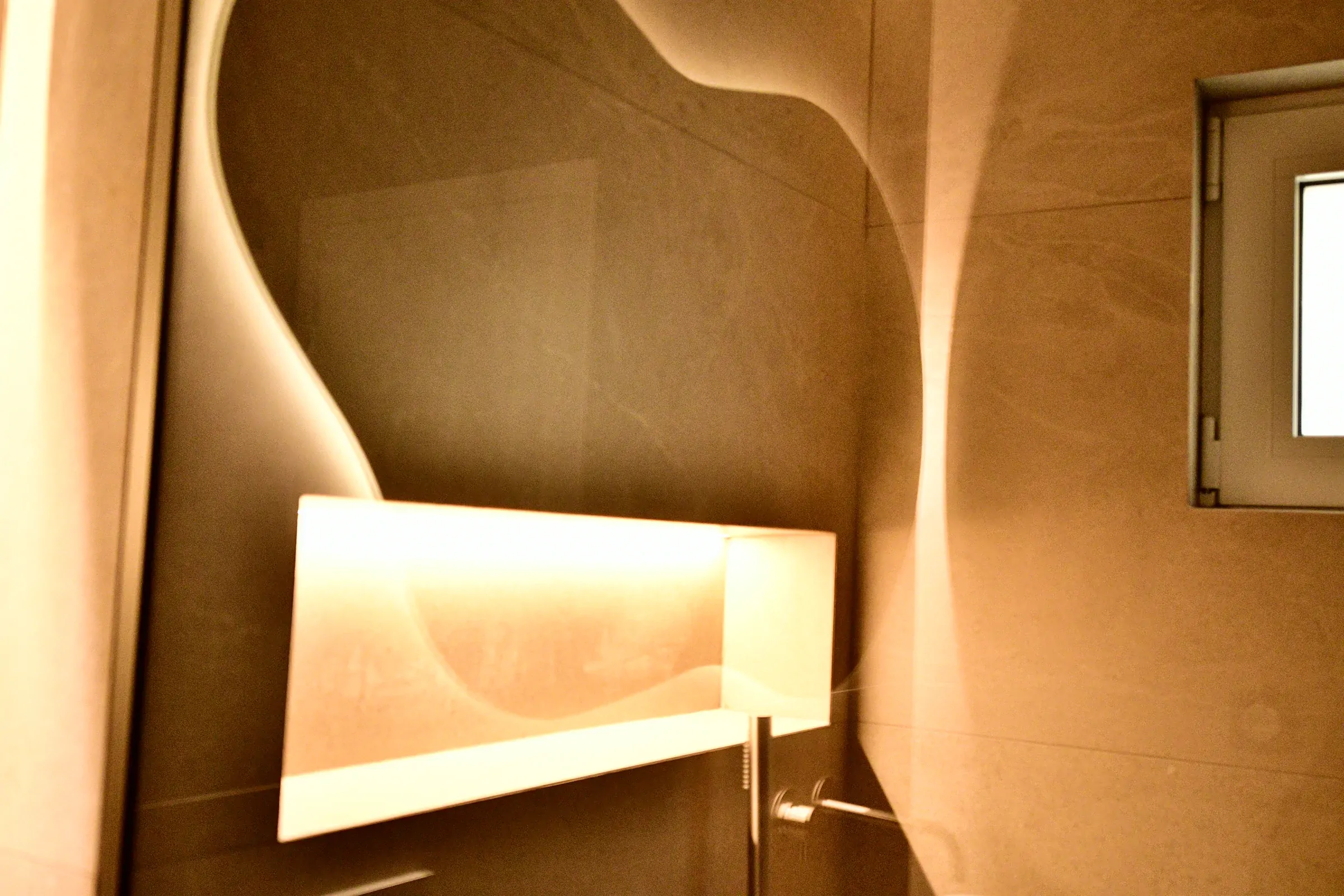 The niche is repeated in the mirror, adding depth to the composition.