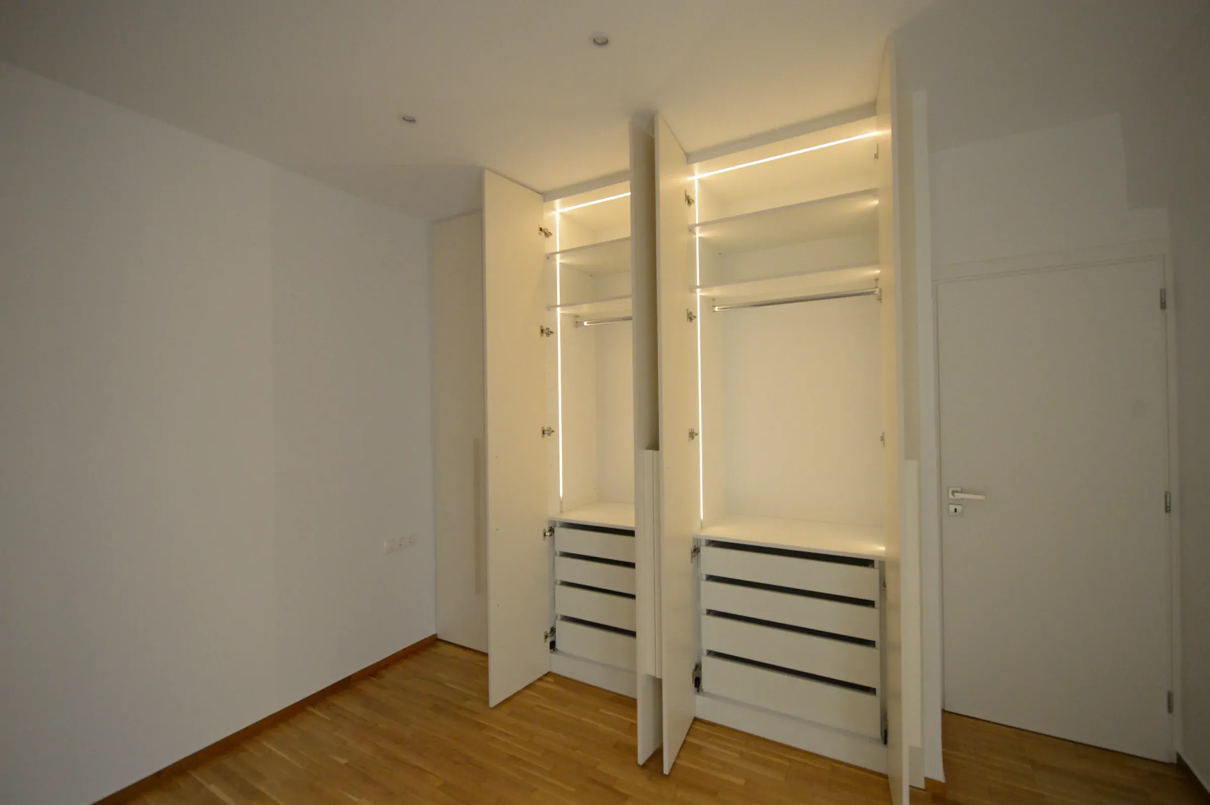 Shelves, rails and drawers are arranged around daily storage needs.