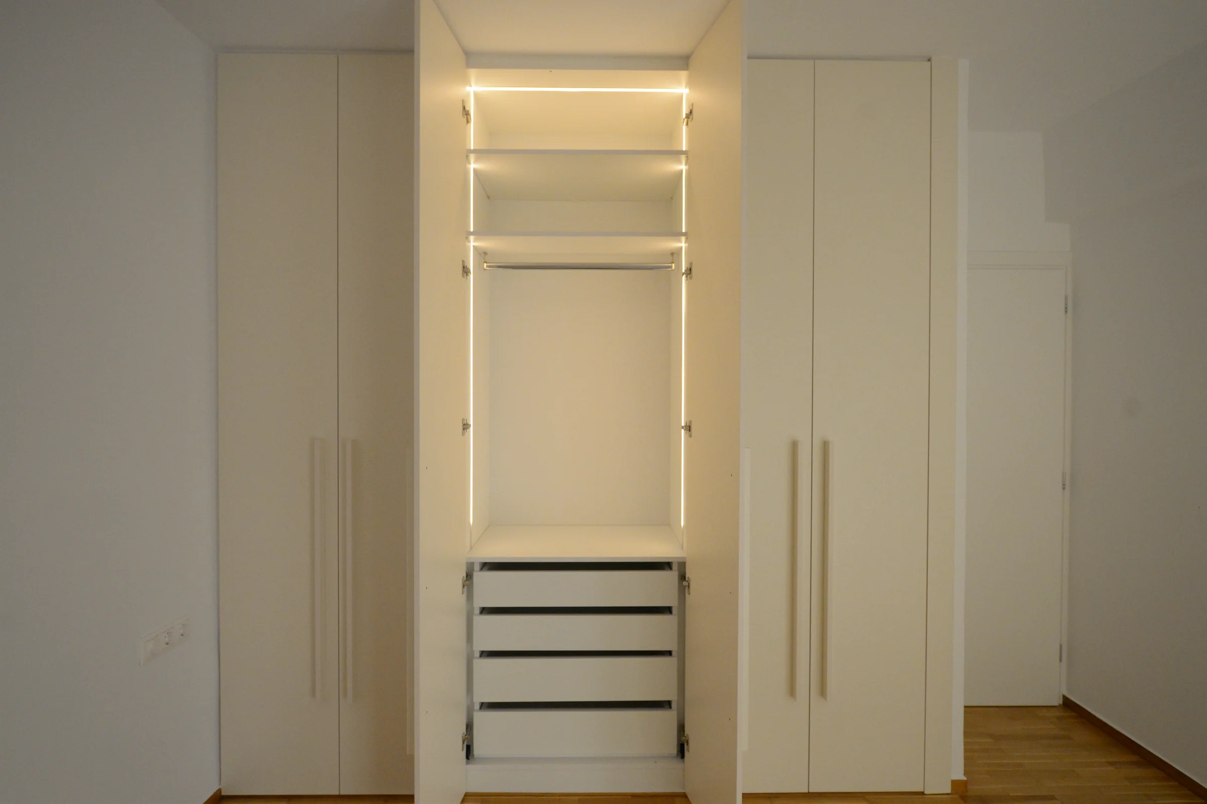 Warm integrated lighting improves visibility and highlights the joinery.