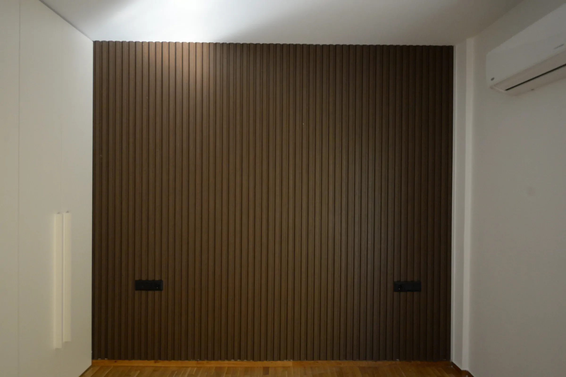Vertical timber elements establish a strong architectural rhythm.
