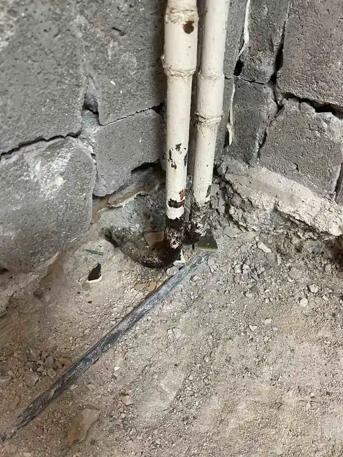 Corroded heating pipes exposed during a Renovator house renovation in Nea Smyrni