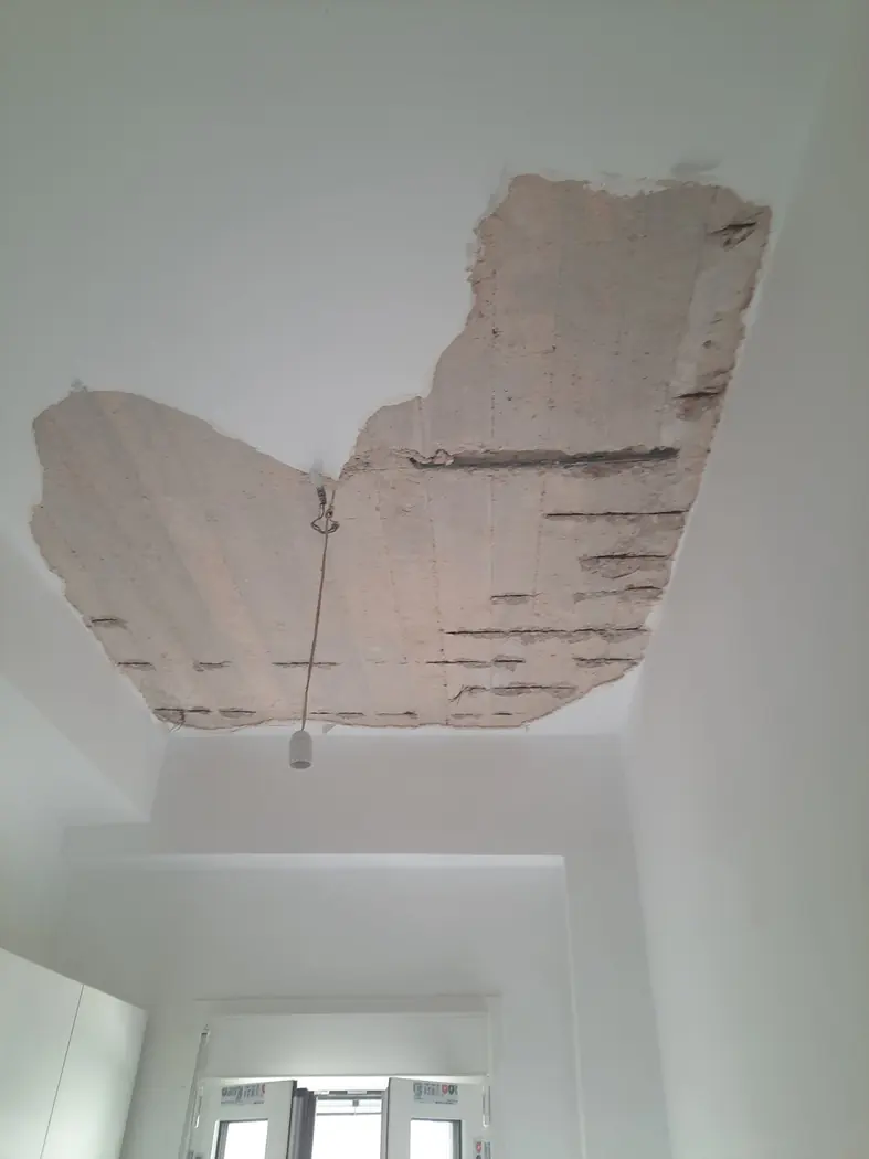Detached ceiling plaster discovered after a leak from the apartment above