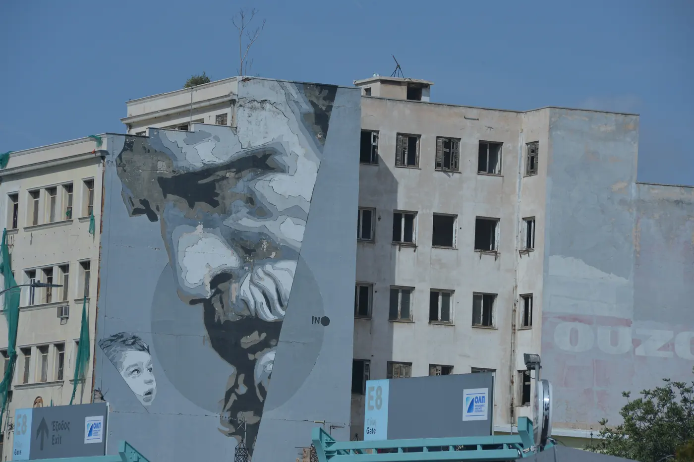 Large street-art mural renewing the appearance of a building façade in Piraeus